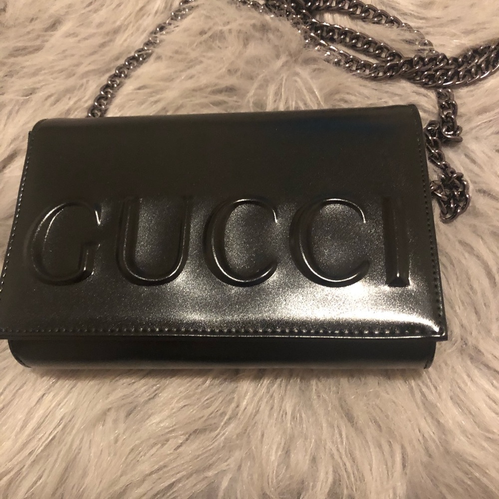 Gucci used as a clutch or a shoulder bag.